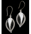 Close up of beautifully delicate "Forever Leaves" filigree earrings handmade in 925 silver on a black background