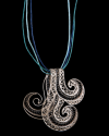 Artisan made Filigree "Wave" pendant necklace made in 925 oxidised and natural silver on a black background