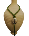 Artisan made ethnic chic art déco pendant necklace made from sabra silk in anise green and a hammered silver sphere with tassel
