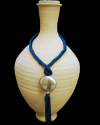 Artisan made ethnic chic art déco pendant necklace made from sabra silk in petrol blue and a hammered silver sphere with tassel