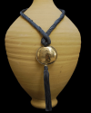 Artisan made ethnic chic art déco pendant necklace made from sabra silk in grey blue and a hammered silver sphere with tassel