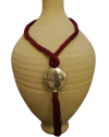 Hand made ethnic chic art déco pendant necklace made from sabra silk in light bordeaux and a hammered silver sphere with tassel