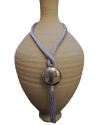 Hand made ethnic chic art déco pendant necklace made from sabra silk in light grey and a hammered silver sphere with tassel