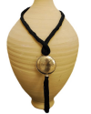 Hand made ethnic chic art déco pendant necklace made from sabra silk in black and a hammered silver sphere with tassel
