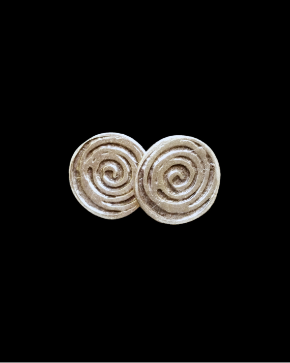 Front view of Andaluchic´s round, swirling patterned "Mirage" stud earrings are made from oxidised silver plated zamak