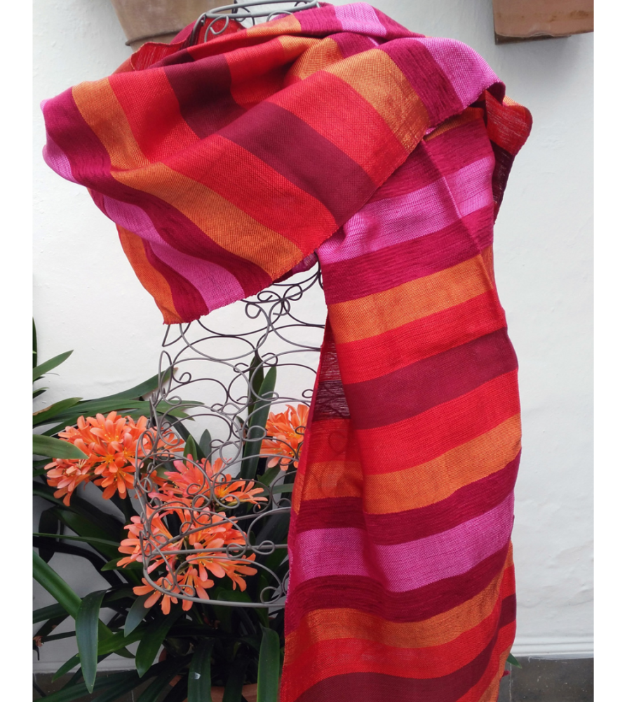 Orange, fuchsia and red pashmina shawl woven into colored striped fabric