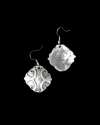 Front & back view of Andaluchic´s "Armour" drop earrings made of oxidised silver plated zamak displayed on a black background
