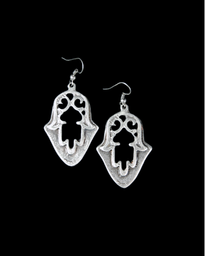 Front view of "Hamsa" drop earrings made from oxidised silver plated zamak @ Andaluchic displayed on a black background