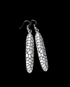 Front view of Andaluchic´s "Zafra" long drop patterned earrings made from oxidised silver plated zamak on a black backdrop
