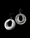 Front & back view of Andaluchic´s "Disc" drop earrings made from oxidised silver plated zamak displayed on a black background