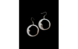 Hypoallergenic moon earrings reminiscent of a waning crescent