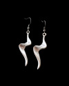 Front view of Andaluchic´s "Ziggy" drop earrings made in oxidised silver plated zamak displayed on a black background