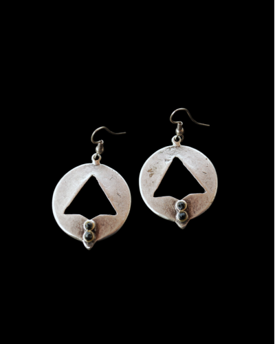 Front view of Andaluchic´s "Sally" drop ethnic earrings made from oxidised silver plated zamak shown on a black background