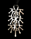 Close up of Andaluchic´s "Tree of Life" pendant necklace made from oxidised silver plated zamak on a black background