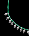 Close up of Andaluchic´s delicate "Crete" Necklace in antiqued silver plated zamak strung with green beads on a black backdrop