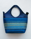 Blue handbag in goatskin leather and striped fabric in mixed blues