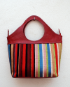 Red handbag in goatskin leather with vertical multicolored striped fabric