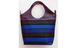 Large purple leather tote with striped fabric in royal blue and black