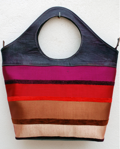 Large purple handbag in soft goatskin leather with colorful striped fabric