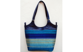 Large blue leather shoulder bag with blue, turquoise, purple and gold striped fabric