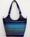 Large blue leather shoulder bag with blue, turquoise, purple and gold striped fabric