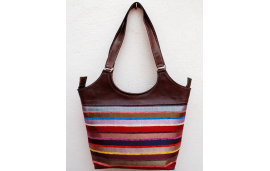 Large dark brown leather shoulder bag with multicolored striped fabric