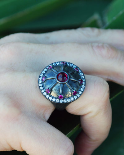 Oxidised silver Byzantine style Line Shield Cocktail Ring inserted with pinky red zircons & clear zircons all around the edge