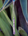 Detalle de colgante "Mezzuza" étnico de plata 925 oxidada colgada de una cadena de plata insertada con cristales swarovski