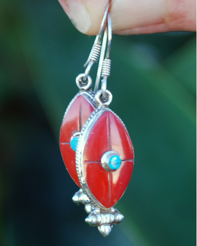 Long Oval drop earrings hand made in silver inset with semi-precious stones of red coral with a small central turquoise