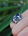 Side view of the "Flame" Ring for him inset with a large black onyx in chunky 925 silver with a flame pattern