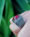 Square shaped chunky Byzantine style ring inset with a deep red diamond cut zircon in 925 silver with a golden patterned overlay