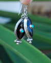 Long Oval drop earrings hand made in silver inset with semi-precious stones of black onyx with a small central turquoise