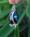 Long Oval drop earrings hand made in silver inset with semi-precious stones of black onyx with a small central turquoise