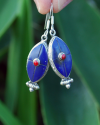 Long Oval drop earrings hand made in silver inset with semi-precious stones of lapis lazuli with a small central red coral