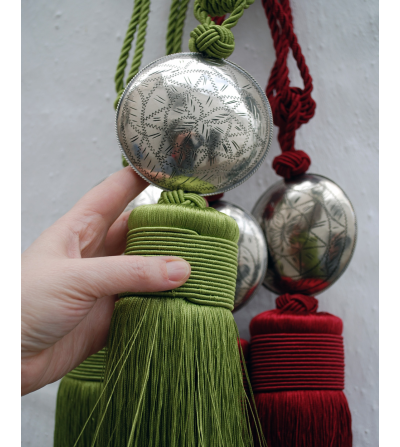 Small tassels and curtain tie backs with engraved silver sphere