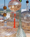 Blown glass sphere with tassel: oriental talisman, witchball, suncatcher