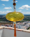 Boule de verre soufflée avec pompon : talsiman, boule de sorcière ou attrape-soleil