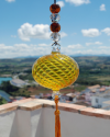 Blown glass sphere with tassel: oriental talisman, witchball, suncatcher