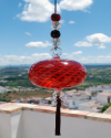 Blown glass sphere with tassel: oriental talisman, witchball, suncatcher