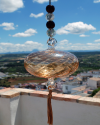 Blown glass sphere with tassel: oriental talisman, witchball, suncatcher