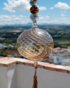 Blown glass sphere with tassel: oriental talisman, witchball, suncatcher