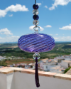 Blown glass sphere with tassel: oriental talisman, witchball, suncatcher