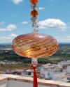 Boule de verre soufflée avec pompon : talsiman, boule de sorcière ou attrape-soleil