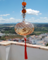 Blown glass sphere with tassel: oriental talisman, witchball, suncatcher